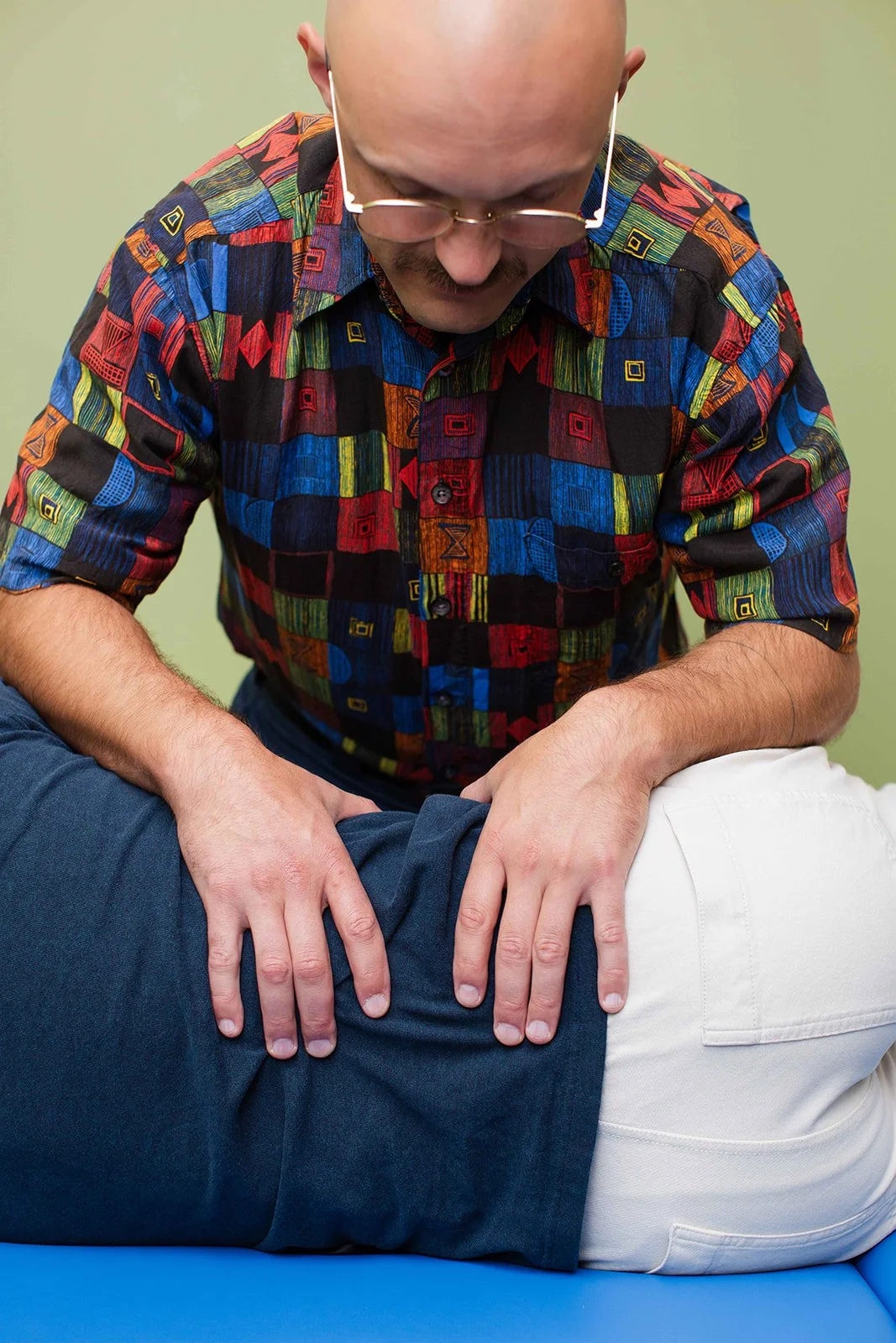 A close view of gentle hands-on osteopathic care